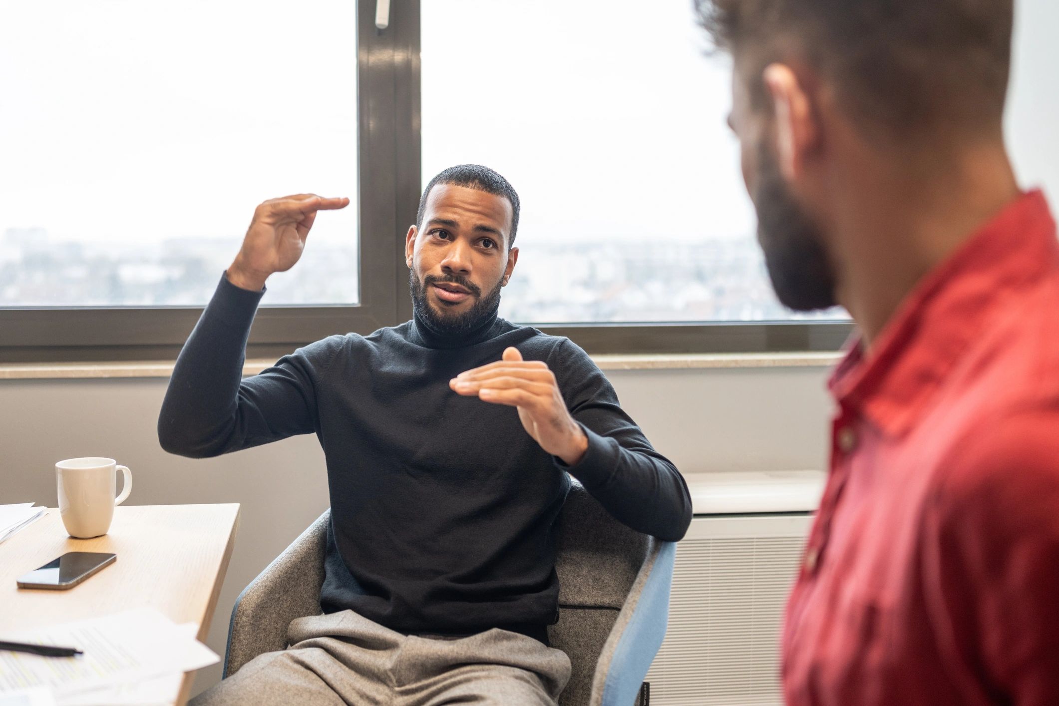 Professional coaching discussion between colleagues