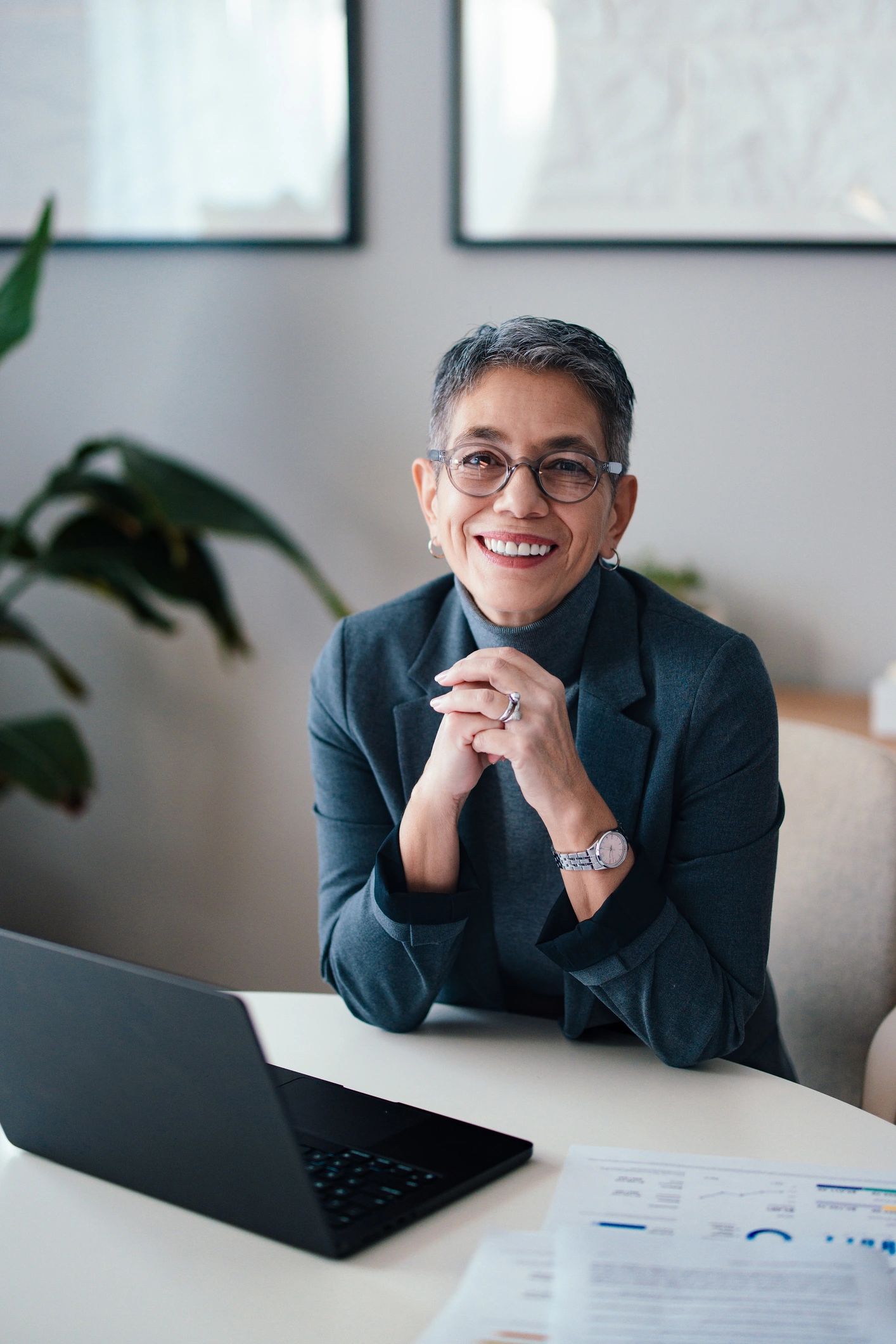 Professional business coach smiling in a modern office